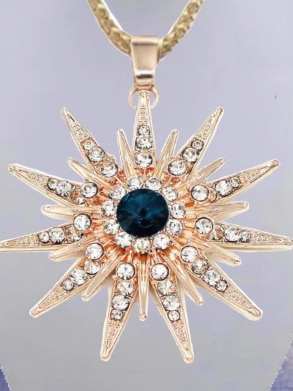 Betsey Johnson Gold Starburst Necklace with Blue Center
